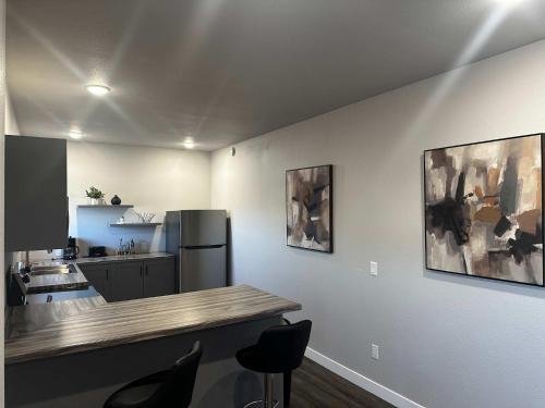a kitchen with a counter and a refrigerator at Downtown Loft in International Falls