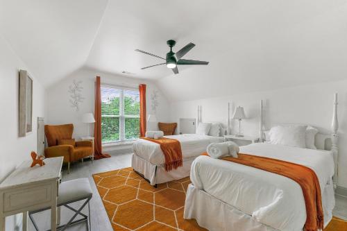a bedroom with two beds and a ceiling fan at Welcome Home! in Lawrenceville