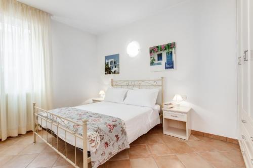 Residenza Aurora del Mareにあるベッド