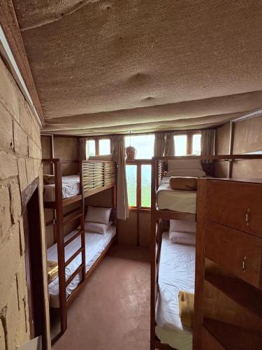 a room with two bunk beds in a house at Art Mile Kalimpong in Kalimpong
