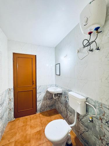 a bathroom with a toilet and a sink at Tony apartment baga in Baga