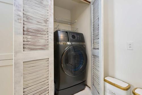 a washer and dryer in a laundry room at Private DC Retreat on Iconic East Capitol St in Washington, D.C.