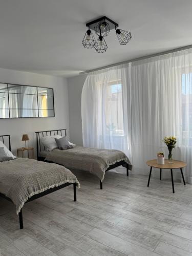 Postel nebo postele na pokoji v ubytování Apartament z widokiem na Zamek