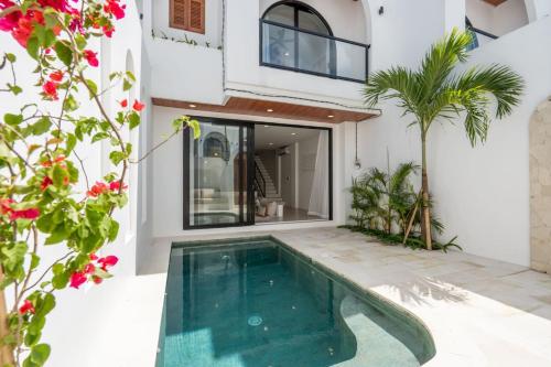 a swimming pool in the backyard of a house at Amal Villa #10 by Bali Bliss Properties in Mengwi