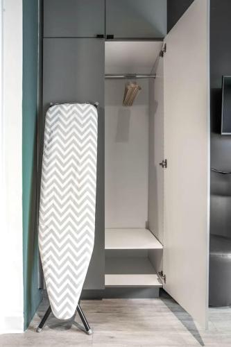a walk in closet with a white and gray cabinet at Vibrant Ybor Studio Free Parking Close to DT in Tampa
