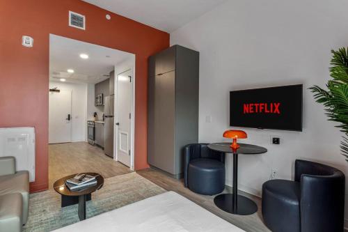 a living room with a couch and a table at Perfect Ybor Studio Free Parking Near DT Vibes in Tampa