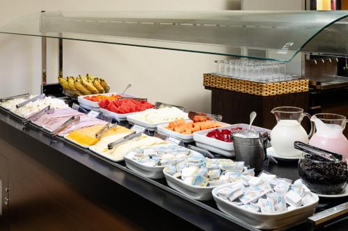 a buffet line with many different types of food at Savoy Othon Lite in Rio de Janeiro