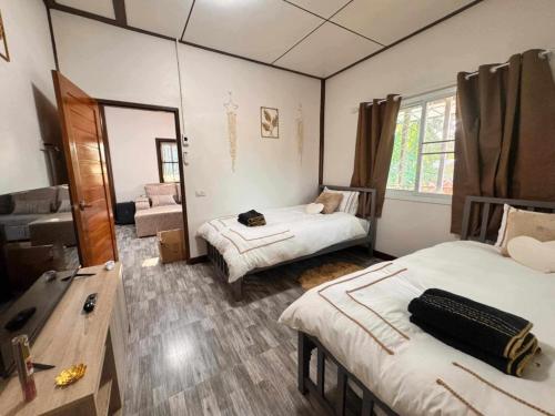 Ένα ή περισσότερα κρεβάτια σε δωμάτιο στο Hua Hin House