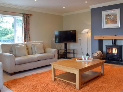 a living room with a couch and a coffee table at Pleasant Valley in New Hedges