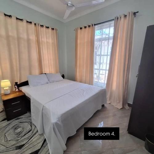 Ένα ή περισσότερα κρεβάτια σε δωμάτιο στο The elfa home - family recede