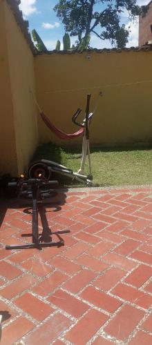 a couple of objects sitting on a brick patio at Yellow House Hostel in Medellín