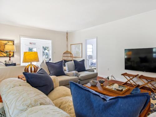 a living room with two couches and a tv at Bankors Aweigh in Mount Pleasant