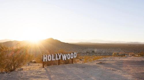 a sign for a hollywood sign in the desert at Beyond: Historic Rock & Roll Studio in Sunfair Heights