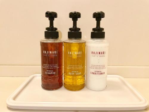 three bottles of essential oils on a tray at Smile Hotel Yonago - Vacation STAY 97659v in Yonago