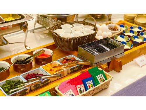 a counter with many different food items on it at Smile Hotel Yonago - Vacation STAY 97656v in Yonago