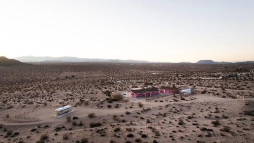 an aerial view of a desert with a house and a boat at Beyond: Historic Rock & Roll Studio in Sunfair Heights