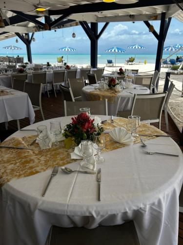 a table set up for a wedding on the beach at Canella Beach Hotel in Le Gosier