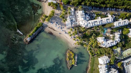 an aerial view of a beach with buildings and the water at Canella Beach Hotel in Le Gosier