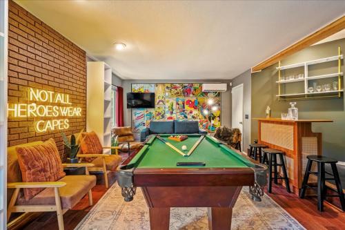 a living room with a pool table in it at Sleeps 14 Hot Tub Paddle Boards Arcade Games in East Stroudsburg