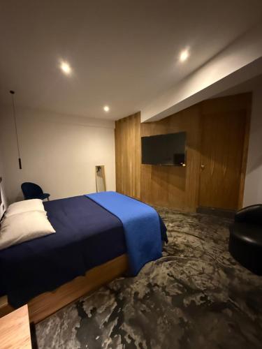 Una cama o camas en una habitación de Hosteria 7