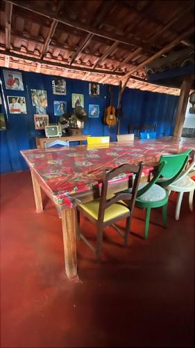 a table with four chairs sitting around it at Pousada Fuego in Ouro Preto