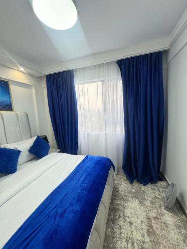Postel nebo postele na pokoji v ubytování Orchid residency