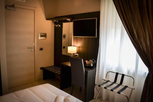 Postel nebo postele na pokoji v ubytování Brain Rooms & Suite
