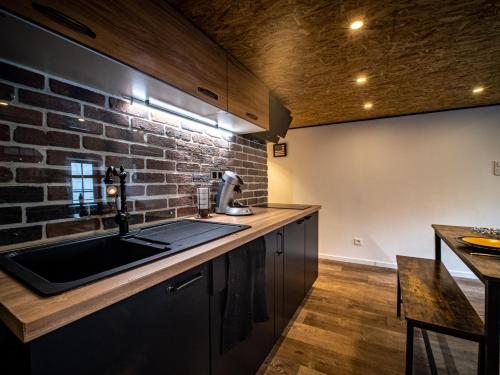 Η κουζίνα ή μικρή κουζίνα στο Le Petit New York Industriel Hyper Centre Place Stan Logements Insolites