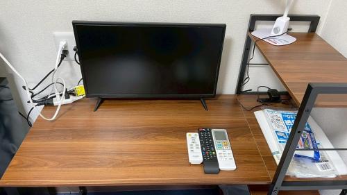 TV a/nebo společenská místnost v ubytování 種子島ホテルウエストフロント