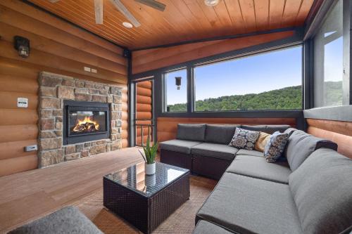 a living room with a couch and a fireplace at High Fa-Lootin by American Patriot Getaways in Oldham