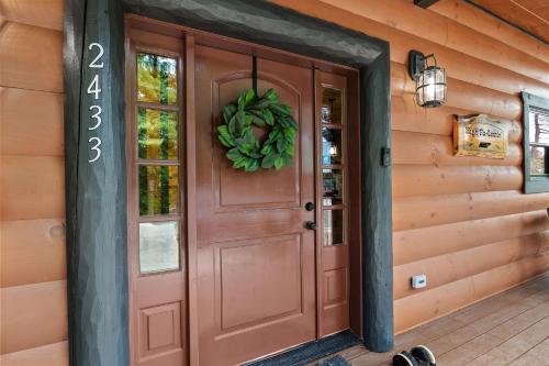 a front door of a house with areath on it at High Fa-Lootin by American Patriot Getaways in Oldham