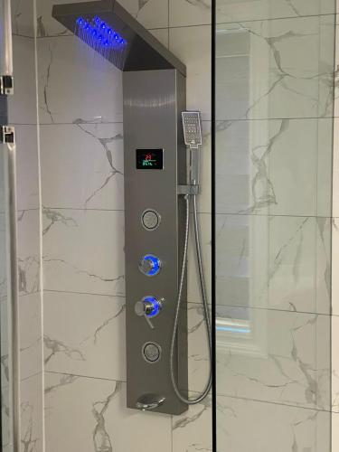 a shower in a bathroom with aperature at Grandeur Homes in Whitby