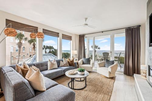 a living room with a couch and a table at Tranquillity on 30A Unit# 210 by 30A Escapes in Seacrest