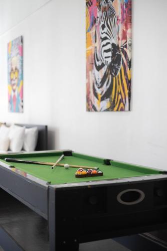 a pool table in a room with at 4 Stylish Lofts in Old Montreal in Montréal