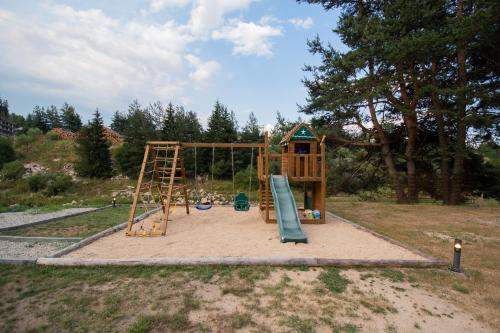 a playground with a slide and a ladder at Hyggemate - Nordic Villa with Sauna & Jacuzzi Retreat in Sarnitsa