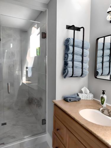 a bathroom with a shower and a sink at Water Street Retreat in Chelan