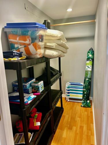a closet with a shelf with food and a snowboard at Water Street Retreat in Chelan