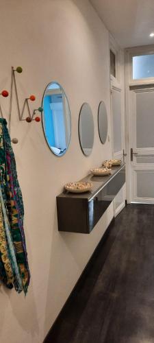a bathroom with two sinks and a mirror on the wall at Eden Riviera in Beausoleil