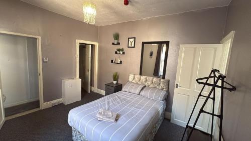 a bedroom with a bed and a ladder in it at Blackpool Pleasure Beach whole Holiday Home! in Blackpool