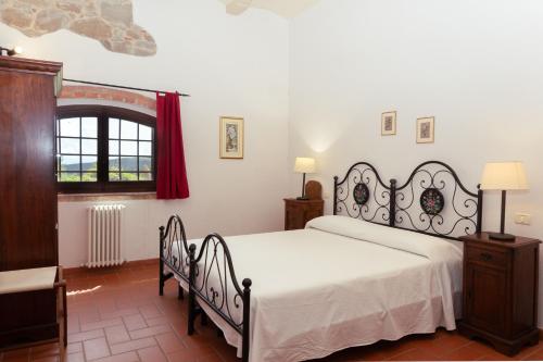 a bedroom with a white bed and a window at Giovanni in Rapale