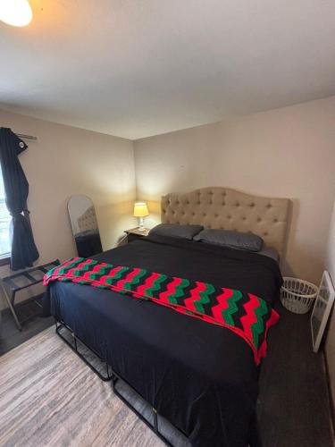 a bedroom with a bed with christmas decorations on it at Carepoint Residence in Lawnside