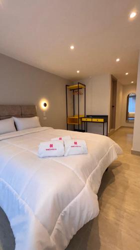 Postel nebo postele na pokoji v ubytování HOTEL COMFORT INN Torre B