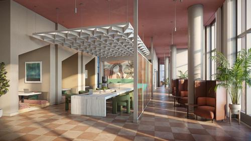 a lobby with a waiting area with chairs and tables at Sentral Sol Modern in Phoenix