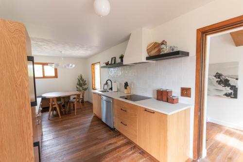 a kitchen with a sink and a counter top at Edelweiss Village & Resort – Chalet Aemmer in Golden
