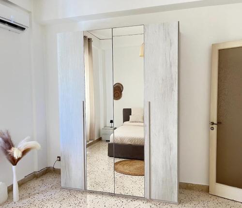a sliding glass door in a bedroom with a bed at Dolce Sicily a 1km dal centro in Palermo