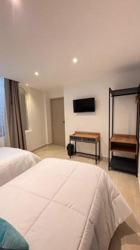 Postel nebo postele na pokoji v ubytování HOTEL COMFORT INN Torre B