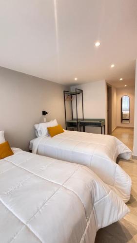 Postel nebo postele na pokoji v ubytování HOTEL COMFORT INN Torre B