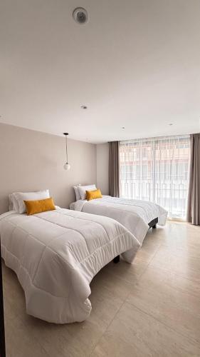 Postel nebo postele na pokoji v ubytování HOTEL COMFORT INN Torre B