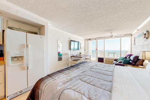 Ένα ή περισσότερα κρεβάτια σε δωμάτιο στο Oceanfront Serenity