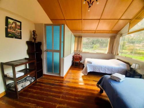 Postel nebo postele na pokoji v ubytování Refugio Andino con Vista Montaña Pet Friendly